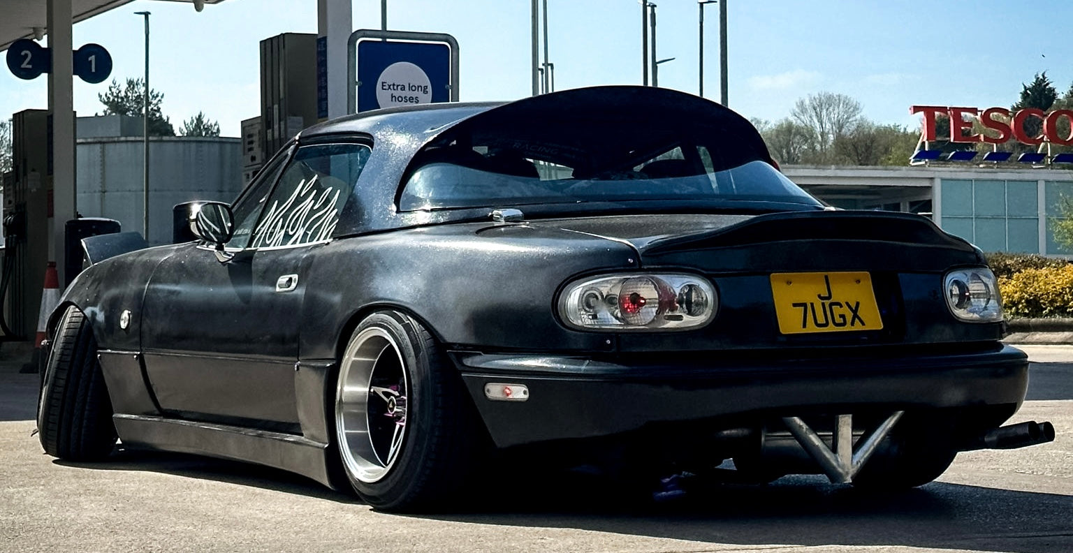 Black MX5 with clear tail lights 